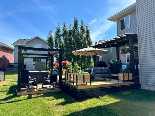 312 Sunset View, Cochrane, AB - Outdoor With Deck Patio Veranda