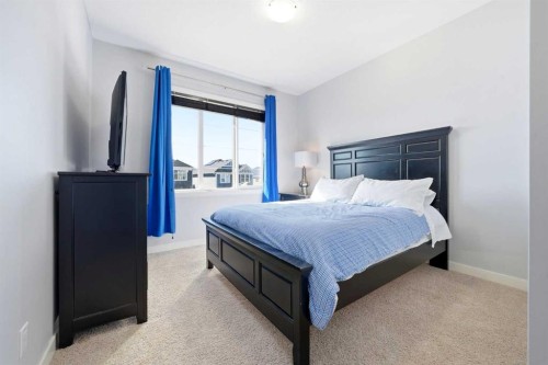 312 Sunset View, Cochrane, AB - Indoor Photo Showing Bedroom