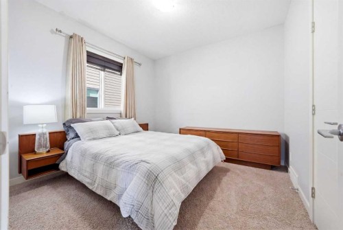 312 Sunset View, Cochrane, AB - Indoor Photo Showing Bedroom