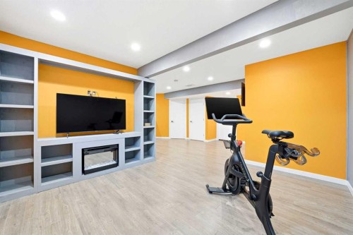 312 Sunset View, Cochrane, AB - Indoor Photo Showing Gym Room