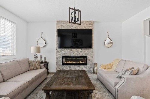 314 Walcrest Way Se, Calgary, AB - Indoor Photo Showing Living Room With Fireplace