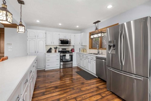 155 Croxford Estates Ne, Airdrie, AB - Indoor Photo Showing Kitchen With Double Sink With Upgraded Kitchen