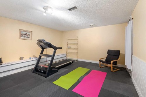 155 Croxford Estates Ne, Airdrie, AB - Indoor Photo Showing Gym Room