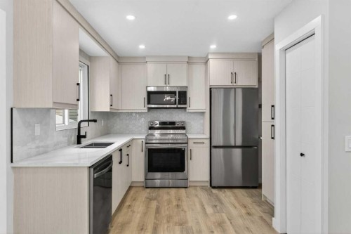 5625 Templehill Road Ne, Calgary, AB - Indoor Photo Showing Kitchen With Double Sink With Upgraded Kitchen