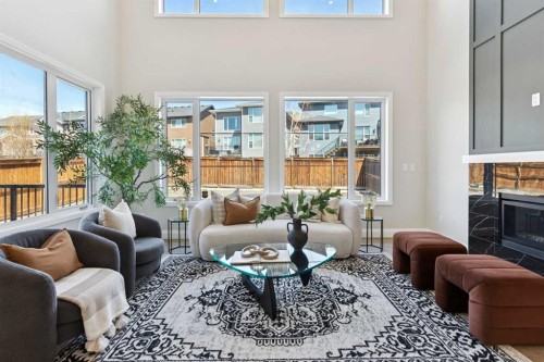 96 Cranbrook Way Se, Calgary, AB - Indoor Photo Showing Living Room With Fireplace