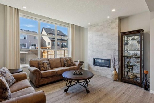 293 Masters Avenue Se, Calgary, AB - Indoor Photo Showing Living Room With Fireplace