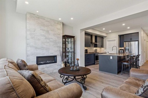 293 Masters Avenue Se, Calgary, AB - Indoor Photo Showing Living Room With Fireplace