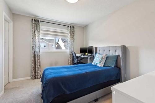 293 Masters Avenue Se, Calgary, AB - Indoor Photo Showing Bedroom