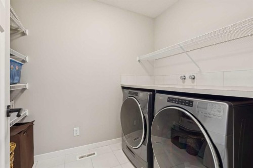 293 Masters Avenue Se, Calgary, AB - Indoor Photo Showing Laundry Room