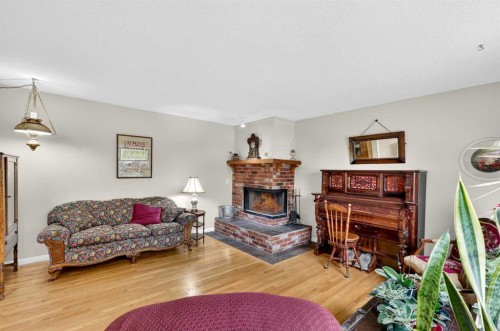 1415 108 Avenue Sw, Calgary, AB - Indoor Photo Showing Living Room With Fireplace