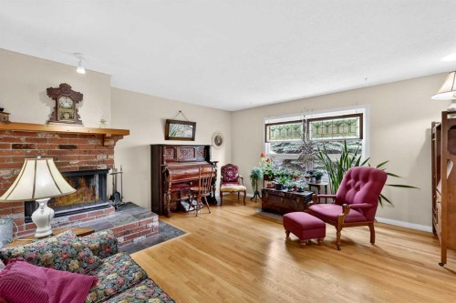 1415 108 Avenue Sw, Calgary, AB - Indoor Photo Showing Living Room With Fireplace