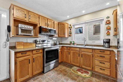 1415 108 Avenue Sw, Calgary, AB - Indoor Photo Showing Kitchen With Double Sink