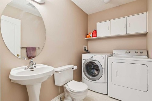 18 Bridlewood Way Sw, Calgary, AB - Indoor Photo Showing Laundry Room