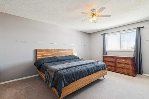 18 Bridlewood Way Sw, Calgary, AB - Indoor Photo Showing Bedroom