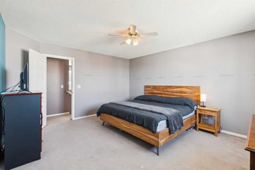 18 Bridlewood Way Sw, Calgary, AB - Indoor Photo Showing Bedroom