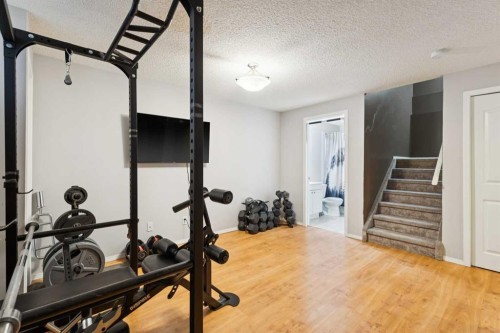 18 Bridlewood Way Sw, Calgary, AB - Indoor Photo Showing Gym Room