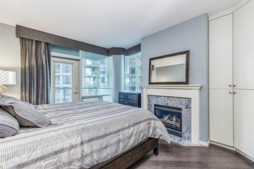 404-837 2 Avenue Sw, Calgary, AB - Indoor Photo Showing Bedroom With Fireplace