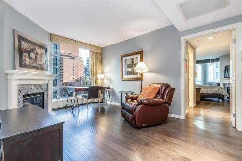 404-837 2 Avenue Sw, Calgary, AB - Indoor Photo Showing Living Room With Fireplace