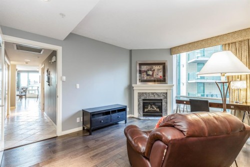 404-837 2 Avenue Sw, Calgary, AB - Indoor Photo Showing Living Room With Fireplace