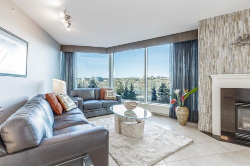404-837 2 Avenue Sw, Calgary, AB - Indoor Photo Showing Living Room With Fireplace