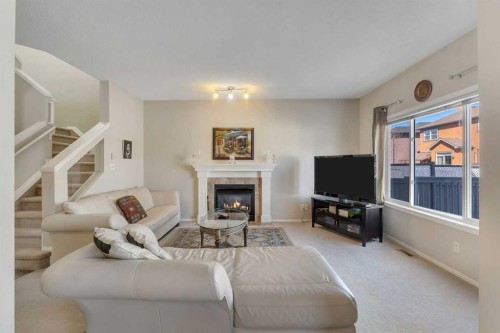 149 Saddlecrest Green Ne, Calgary, AB - Indoor Photo Showing Living Room With Fireplace