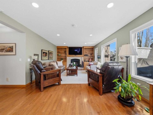 208 Shawnee Gardens Sw, Calgary, AB - Indoor Photo Showing Living Room With Fireplace