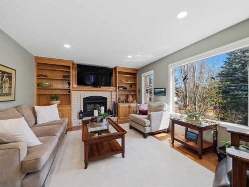 208 Shawnee Gardens Sw, Calgary, AB - Indoor Photo Showing Living Room With Fireplace