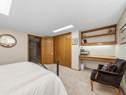 208 Shawnee Gardens Sw, Calgary, AB - Indoor Photo Showing Bedroom