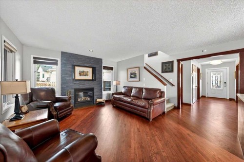 18 Inverness Rise Se, Calgary, AB - Indoor Photo Showing Living Room With Fireplace