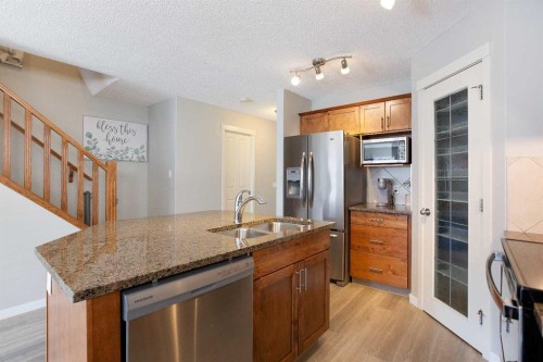 30 Cranwell Common Se, Calgary, AB - Indoor Photo Showing Kitchen With Double Sink
