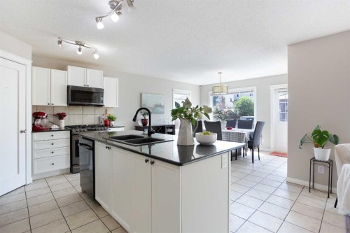 403 Morningside Way Sw, Airdrie, AB - Indoor Photo Showing Kitchen With Double Sink