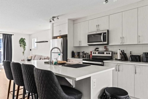 463 Cranbrook Square Se, Calgary, AB - Indoor Photo Showing Kitchen With Stainless Steel Kitchen With Upgraded Kitchen