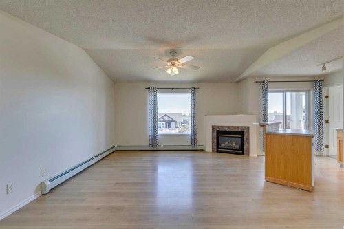 301-7301 Valleyview Park Se, Calgary, AB - Indoor Photo Showing Living Room With Fireplace
