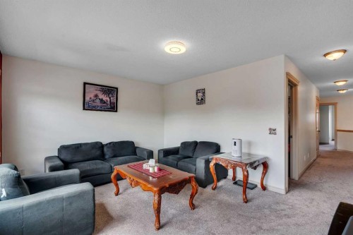 133 Everwoods Close Sw, Calgary, AB - Indoor Photo Showing Living Room