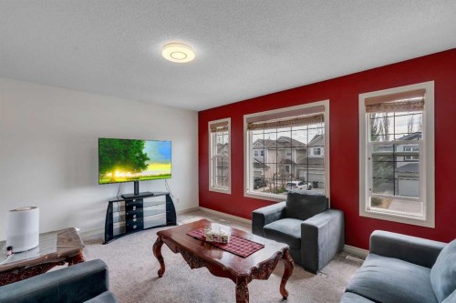 133 Everwoods Close Sw, Calgary, AB - Indoor Photo Showing Living Room