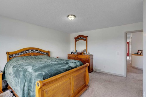 133 Everwoods Close Sw, Calgary, AB - Indoor Photo Showing Bedroom