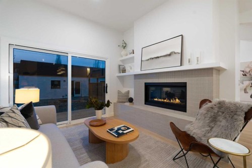 2-8916 33 Avenue, Calgary, AB - Indoor Photo Showing Living Room With Fireplace