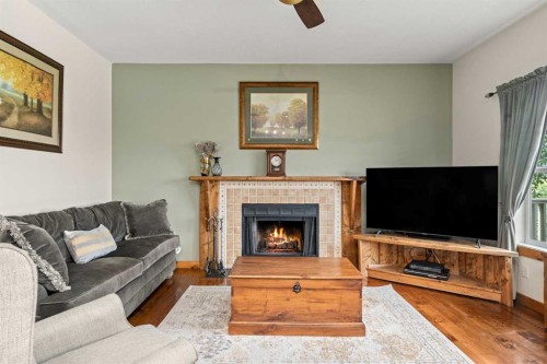 122 Hidden Creek Heights Nw, Calgary, AB - Indoor Photo Showing Living Room With Fireplace