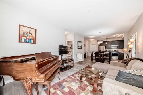 402-30 Shawnee Common Sw, Calgary, AB - Indoor Photo Showing Living Room