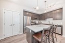 402-30 Shawnee Common Sw, Calgary, AB  - Indoor Photo Showing Kitchen With Stainless Steel Kitchen 
