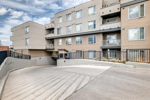 402-30 Shawnee Common Sw, Calgary, AB - Outdoor With Balcony With Exterior