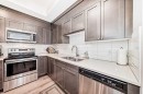 402-30 Shawnee Common Sw, Calgary, AB  - Indoor Photo Showing Kitchen With Stainless Steel Kitchen With Double Sink With Upgraded Kitchen 