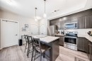 402-30 Shawnee Common Sw, Calgary, AB  - Indoor Photo Showing Kitchen With Stainless Steel Kitchen With Upgraded Kitchen 