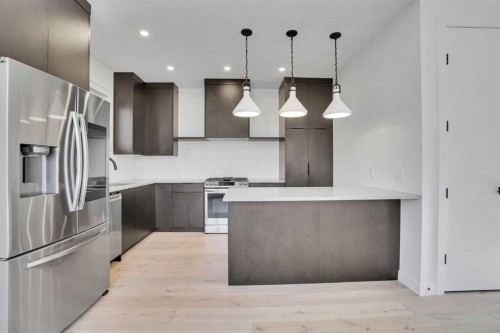 402 26 Avenue Nw, Calgary, AB - Indoor Photo Showing Kitchen With Stainless Steel Kitchen With Upgraded Kitchen