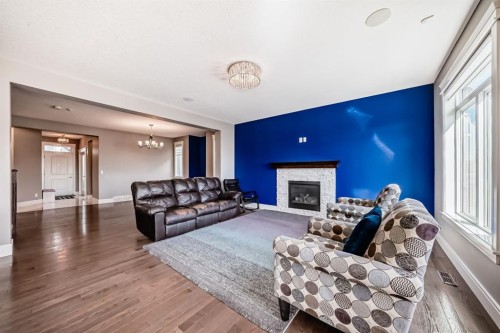 88 Masters Way Se, Calgary, AB - Indoor Photo Showing Living Room With Fireplace