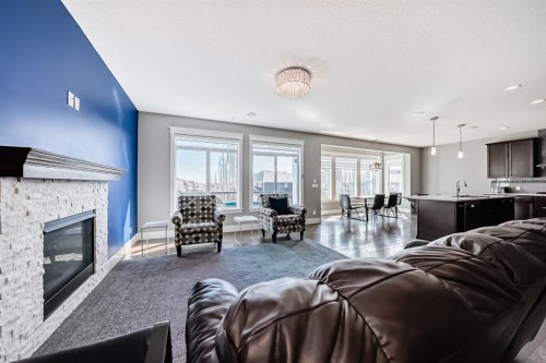 88 Masters Way Se, Calgary, AB - Indoor Photo Showing Living Room With Fireplace