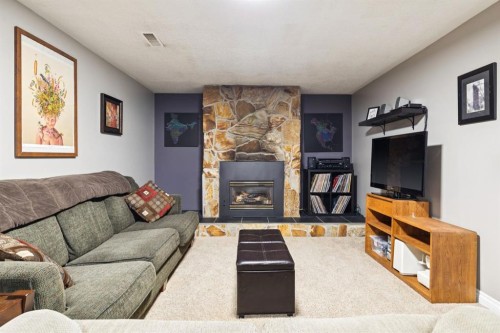 26 Galway Crescent Sw, Calgary, AB - Indoor Photo Showing Living Room With Fireplace
