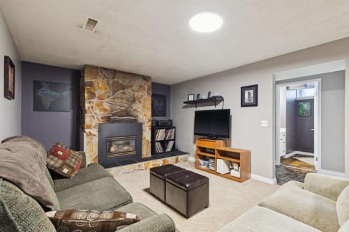 26 Galway Crescent Sw, Calgary, AB - Indoor Photo Showing Living Room With Fireplace