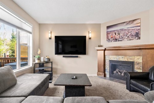 16 Cranarch Grove Se, Calgary, AB - Indoor Photo Showing Living Room With Fireplace