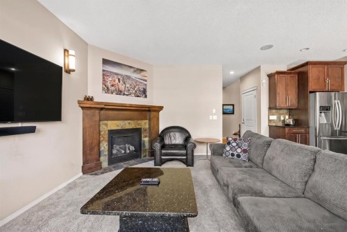 16 Cranarch Grove Se, Calgary, AB - Indoor Photo Showing Living Room With Fireplace